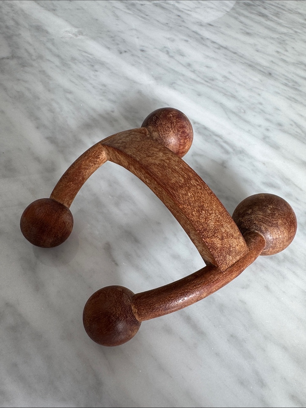 The Body Shop Wooden Handheld Massager in Brown.